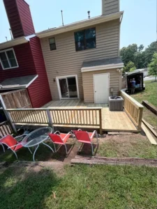 Front part of a wooden house with chairs kept